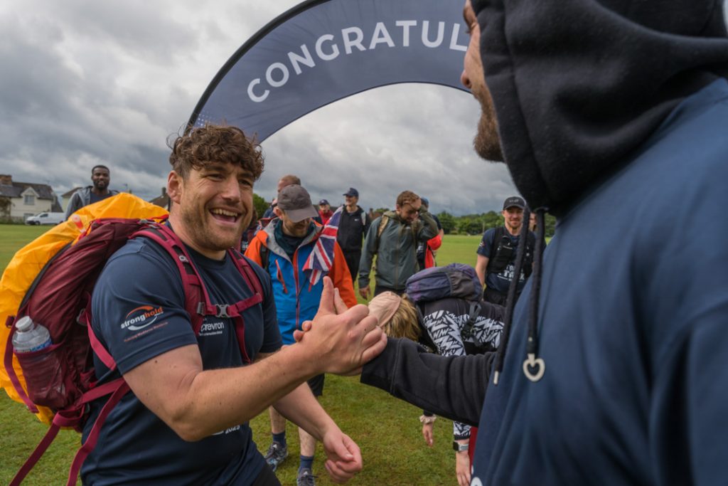 Tommy Trekkers high fiving during fundraising event