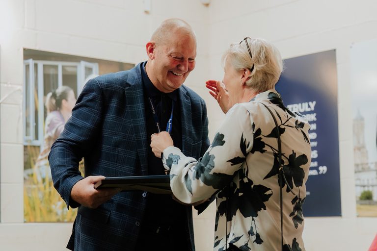 Veteran Steve Hammond laughing with Tommy Club member
