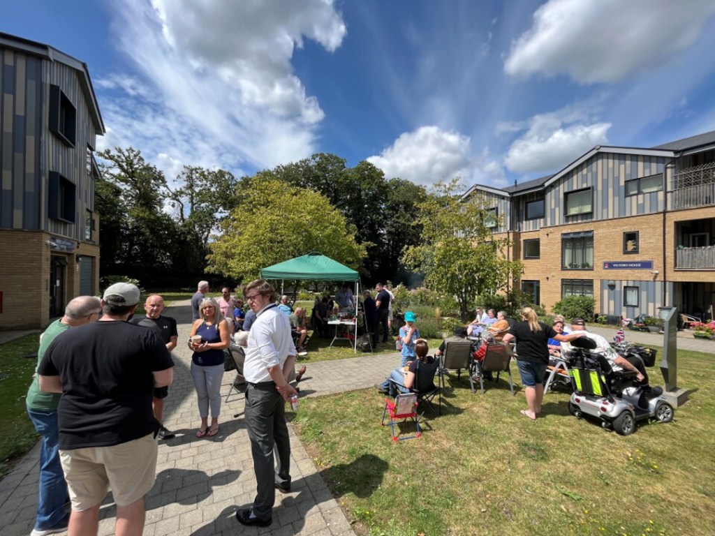 RBVE community socialising in the garden during VJ day celebrations