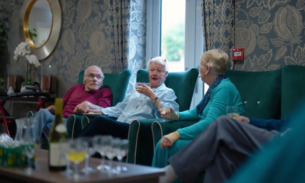 Care residents chatting in their living space