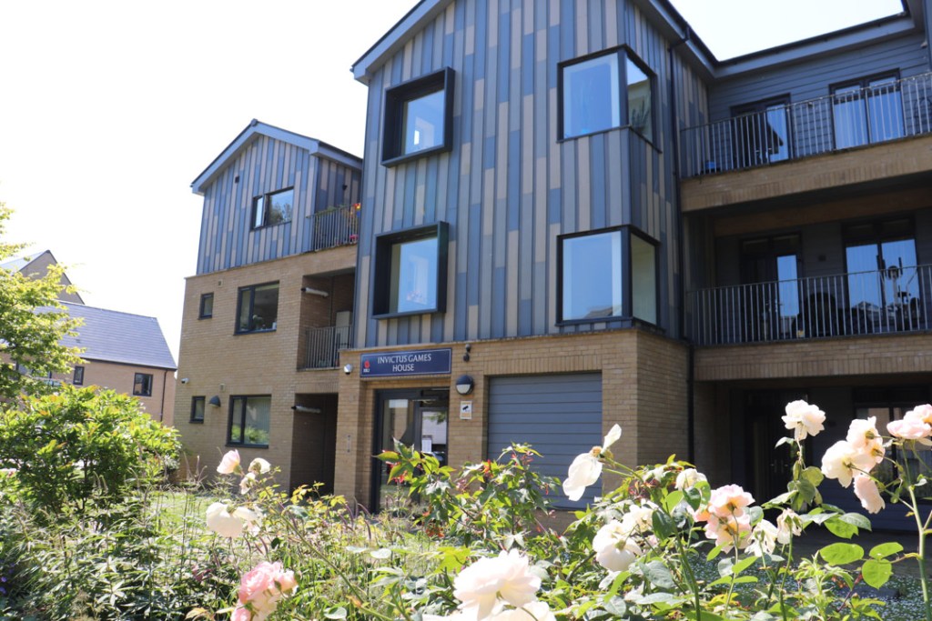 Flowers in front of Invicta Games House in RBVEs Centenary Village