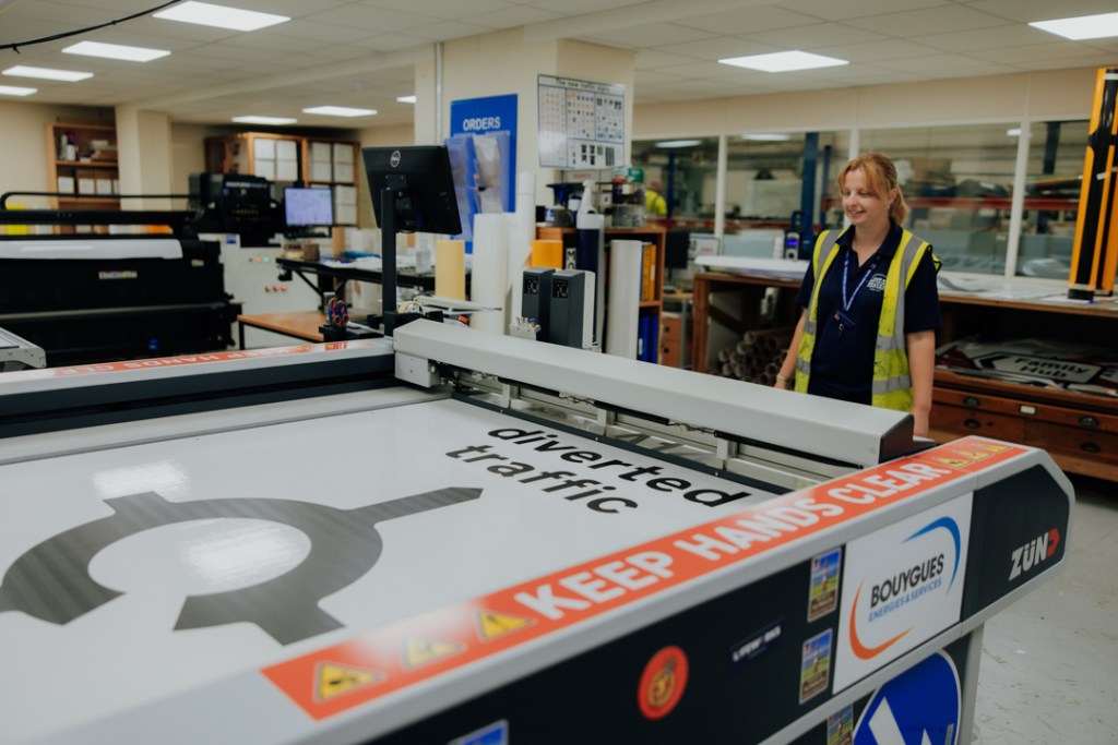 BBMC employee creating a large diverted traffic sign